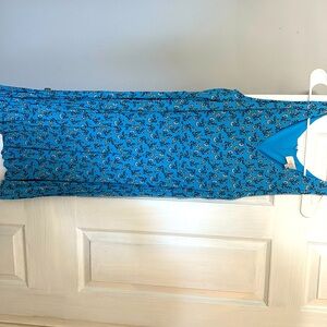Women’s sleeveless V-neck dress. Rayon/polyester/spandex blend. Never worn.